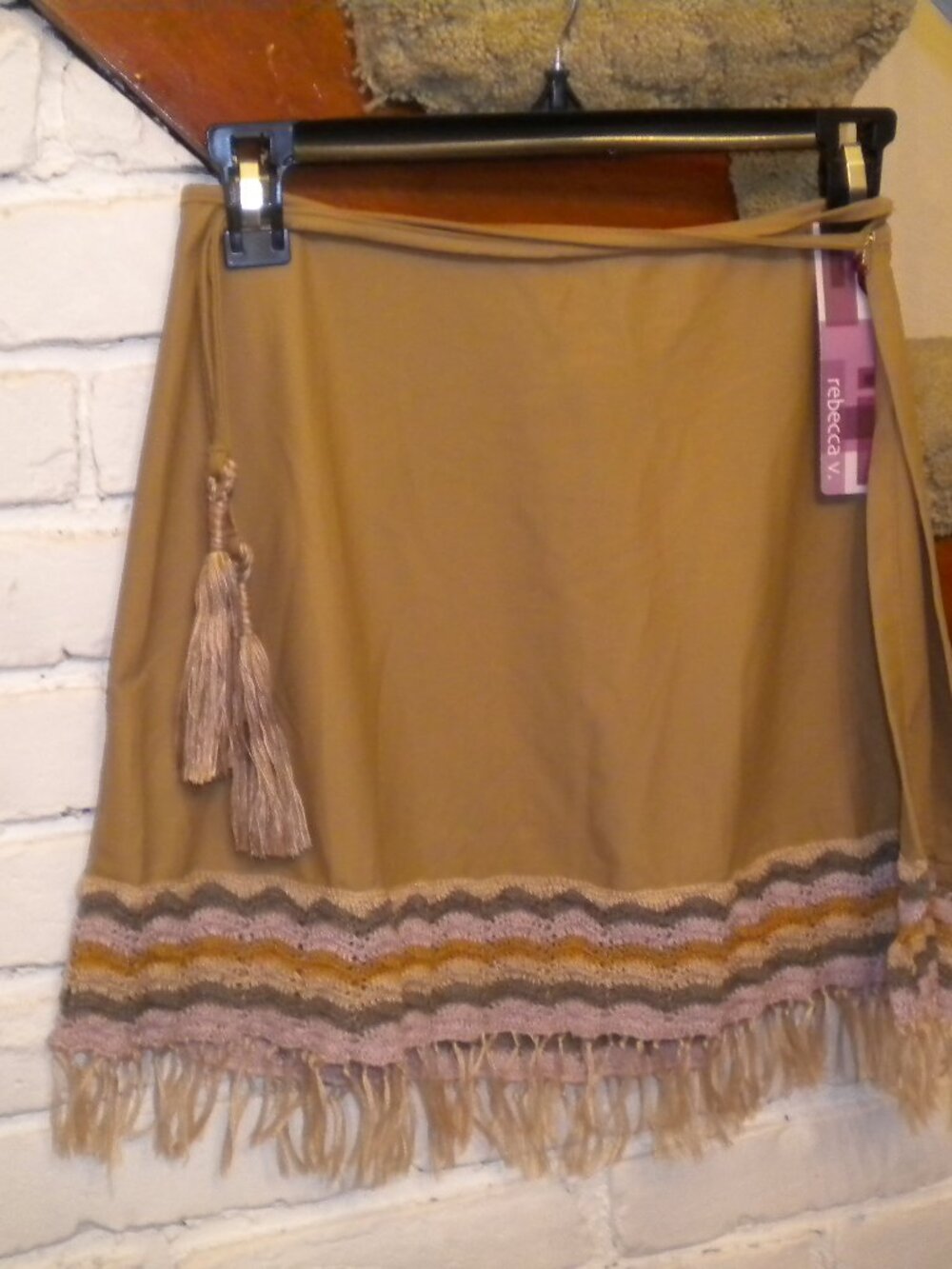 Pretty tan colored sarong, fringed bottom, tassel closing. NWT